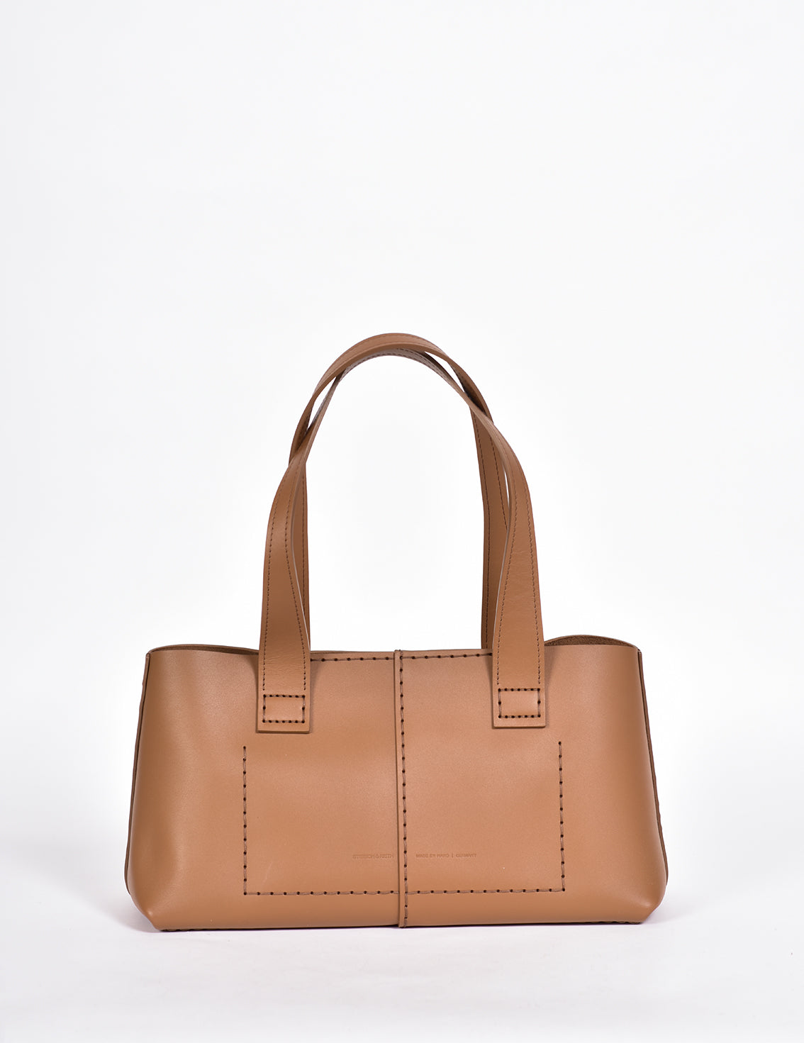 Shopper aus braunem Rindleder mit zwei Handriemen.